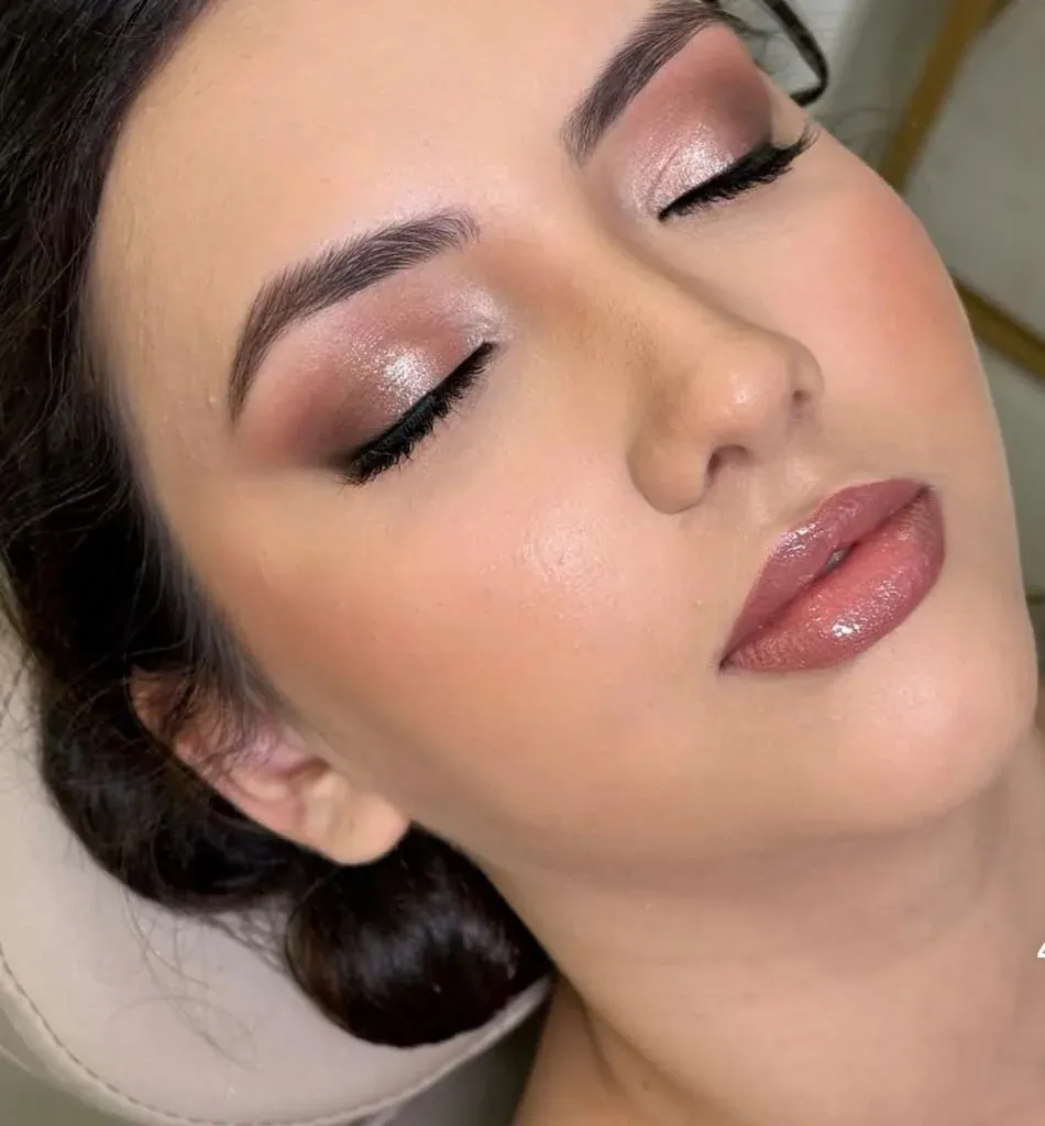 Pink-toned makeup and an updo